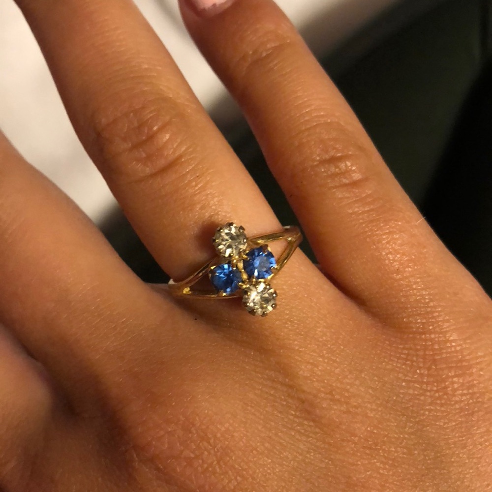 gold adjustable ring with blue and white gems